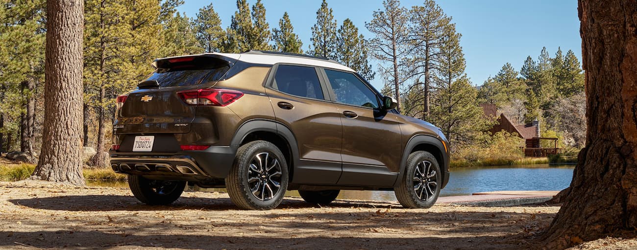 Brown 2021 Chevy Trailblazer parked in front of a lake after visiting a used Chevy dealer.