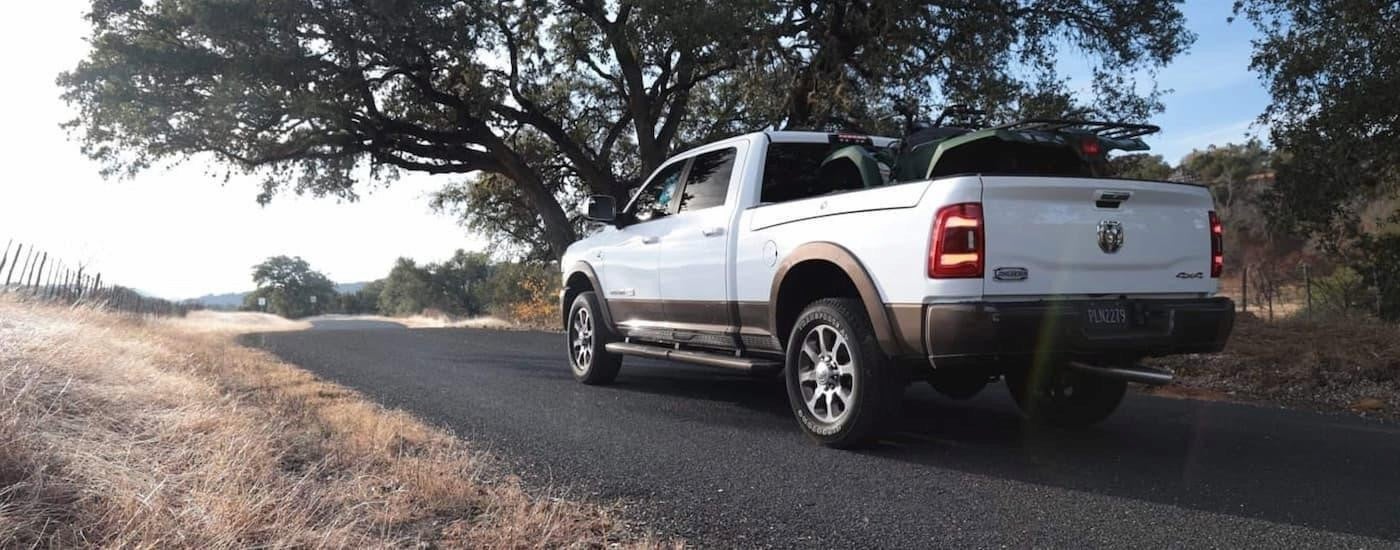 A white 2020 Ram 2500 parked on a gravel road.