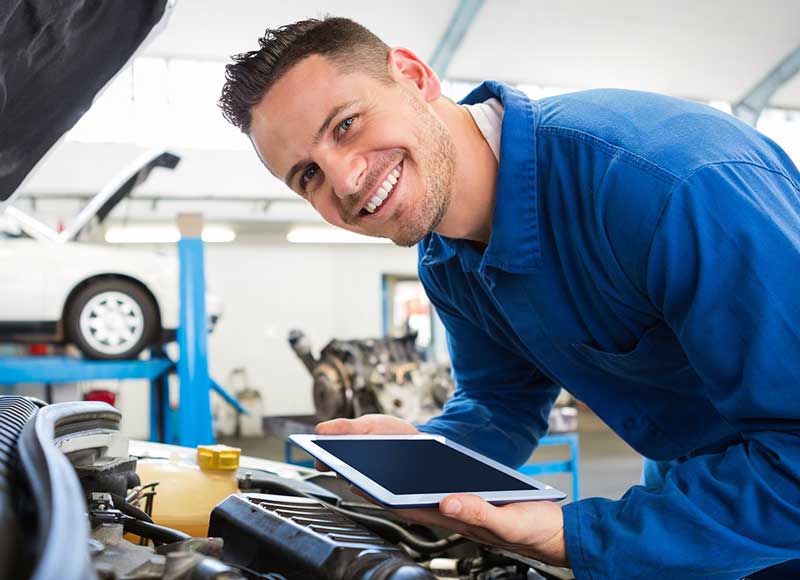 Mechanic looking at a tablet
