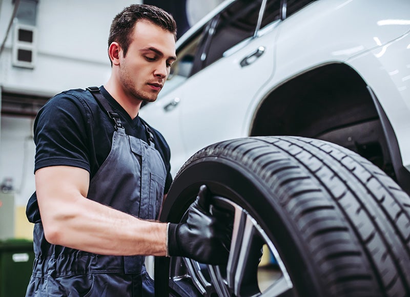Mechanic repairing a tire